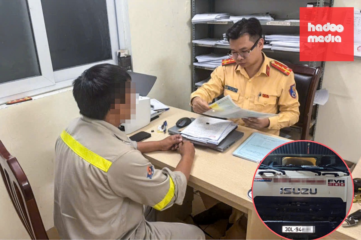Nam tài xế làm việc với cảnh sát - Ảnh: N.A.